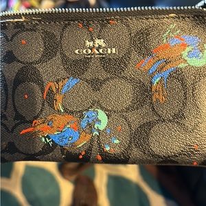 Coach wristlet with turkeys on it